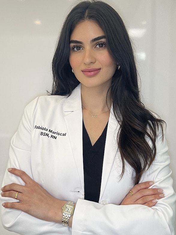 Alchemy43 Provider Fabiola, MSN-FNP-C in white coat. 