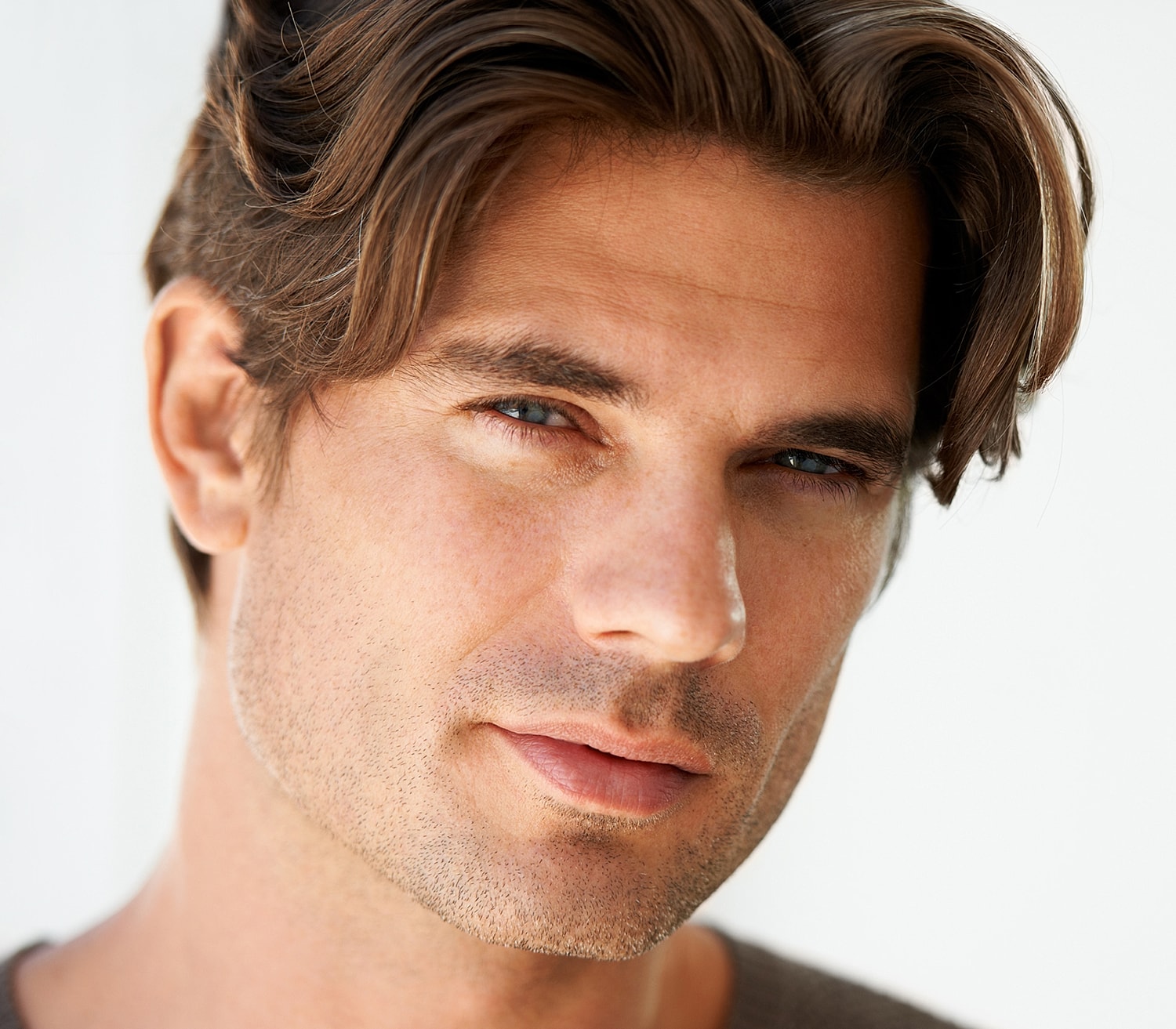 Close-up of a man with tousled hair.