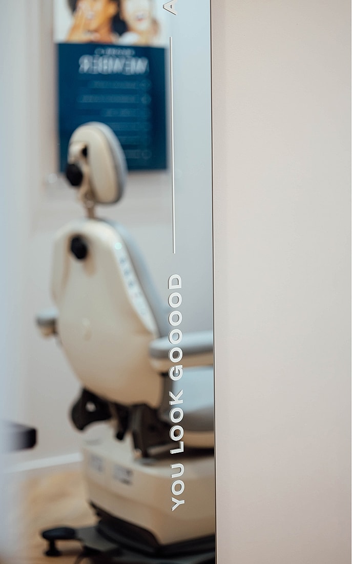 Mirror reflecting encouraging phrase in a clinic.