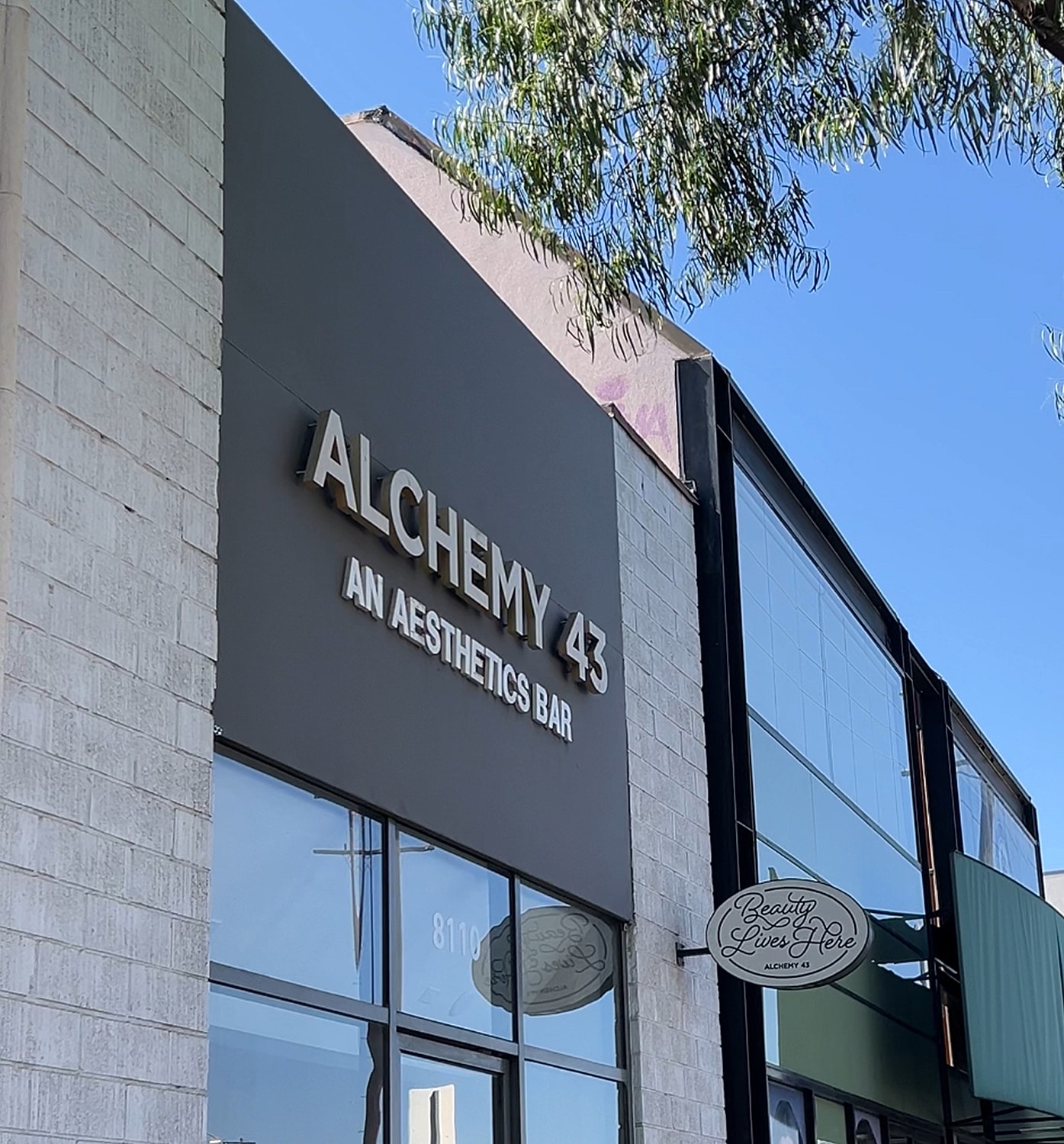 Signage for Alchemy 43 aesthetics bar.